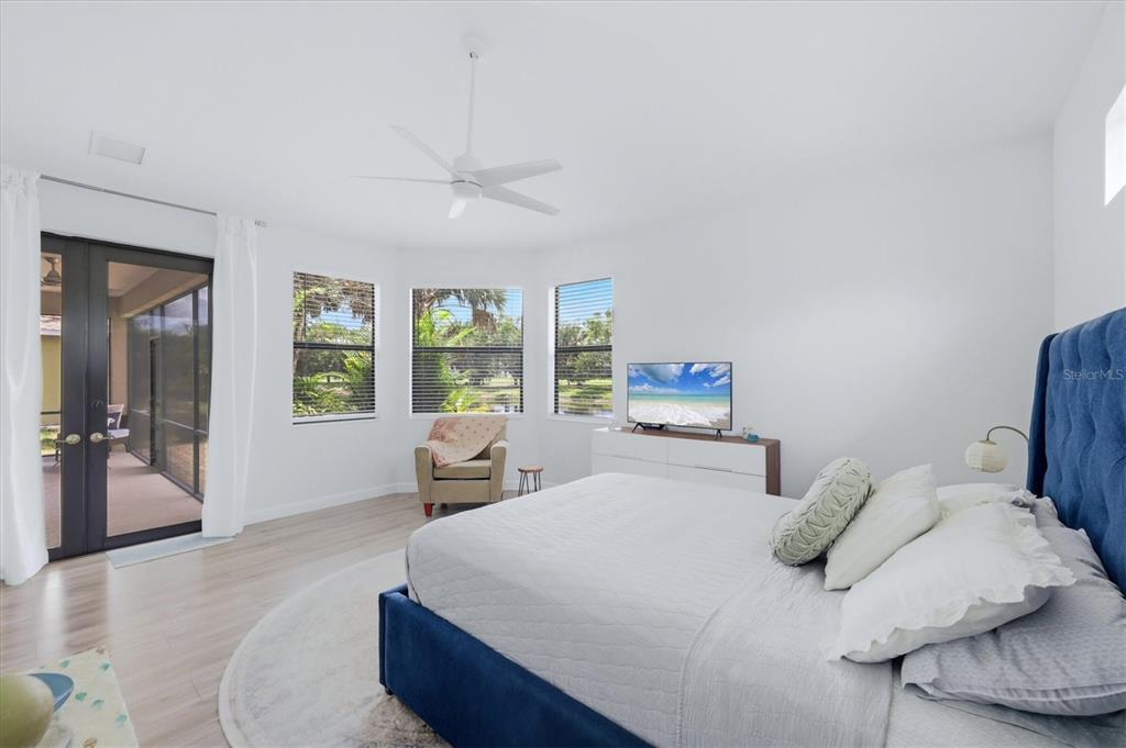 428 Snapdragon Loop Bradenton, FL 34212 - Photo 18 of 33 a bedroom with a large bed and a large window