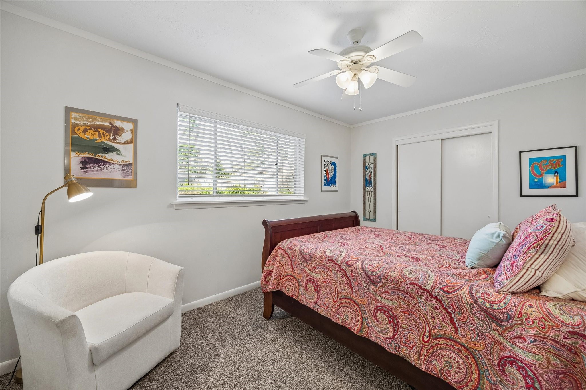 10226 Ivyridge Road Houston, TX 77043 - Photo 35 of 37 a bedroom with a large bed and a chandelier