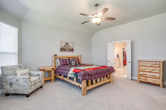 a bed room with a bed and a couch