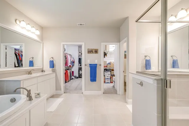 a view of a bathroom with a sink and mirror