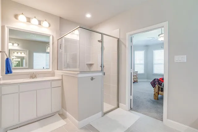 a bathroom with a sink and mirror