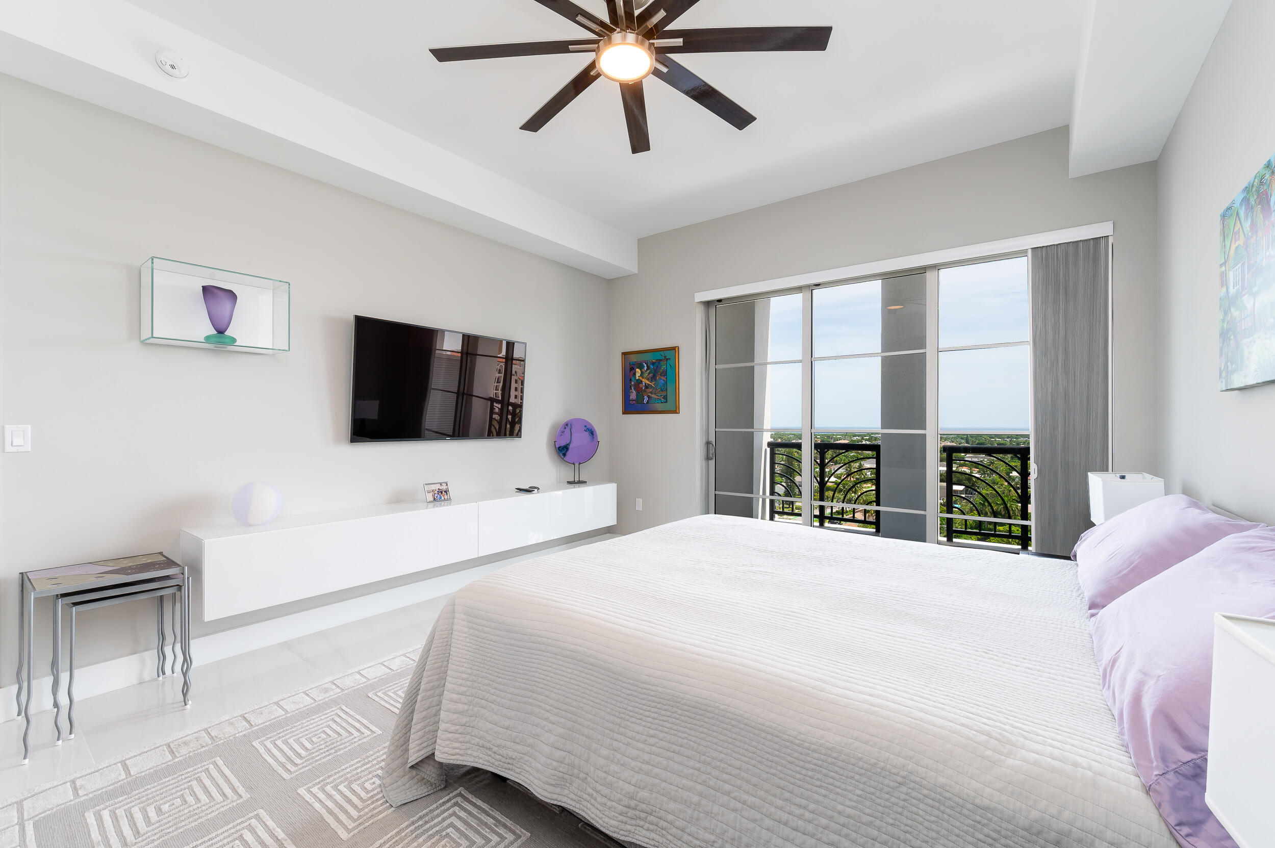 155 East Boca Raton Road, Unit 1107 Boca Raton, FL 33432 - Photo 11 of 53 a large bedroom with a bed tv and a large window