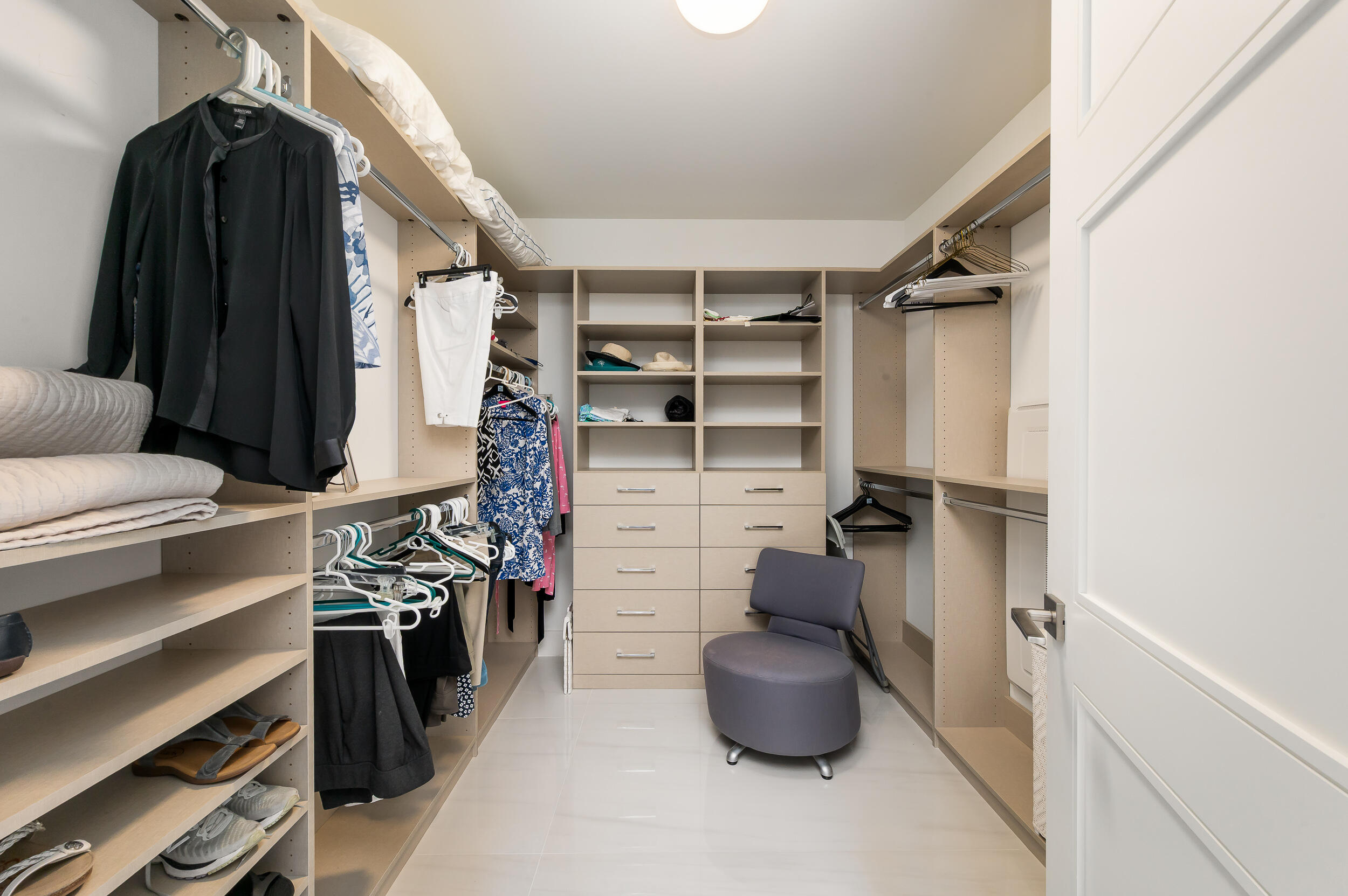 155 East Boca Raton Road, Unit 1107 Boca Raton, FL 33432 - Photo 13 of 53 a view of walk in closet with clothes and shoes