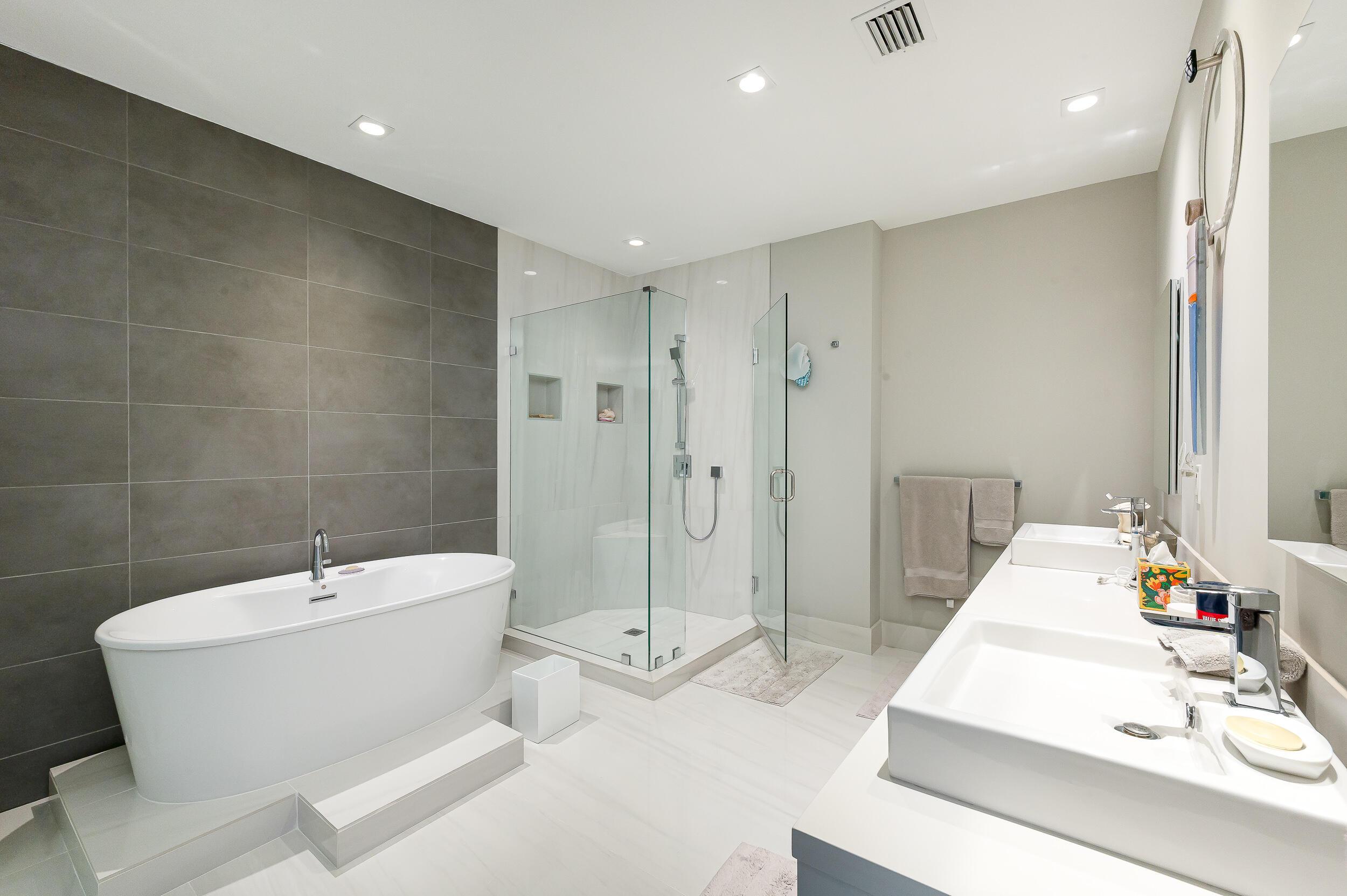 155 East Boca Raton Road, Unit 1107 Boca Raton, FL 33432 - Photo 14 of 53 a bathroom with a white tub shower and sink