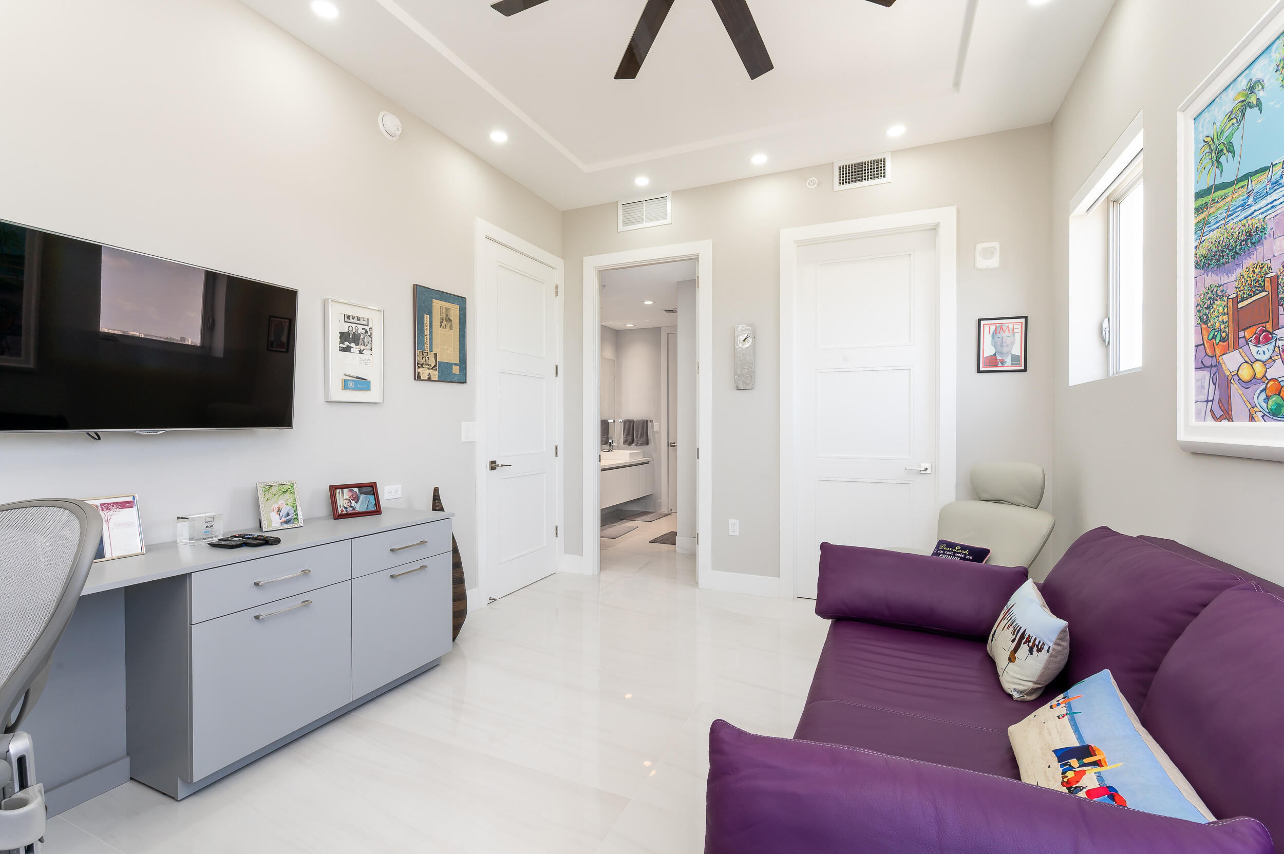 155 East Boca Raton Road, Unit 1107 Boca Raton, FL 33432 - Photo 21 of 53 a living room with furniture and a flat screen tv