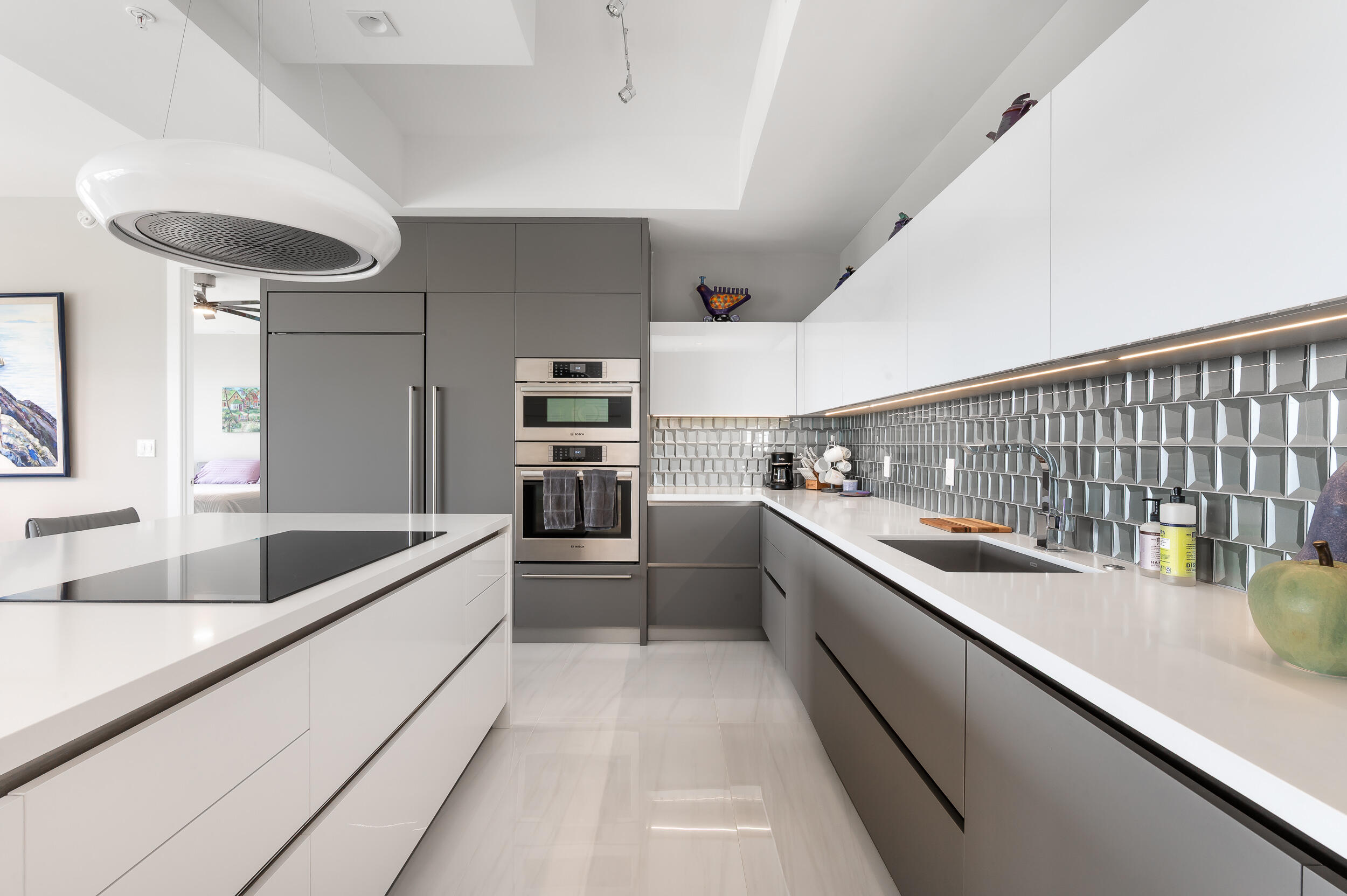 155 East Boca Raton Road, Unit 1107 Boca Raton, FL 33432 - Photo 3 of 53 a large white kitchen with a large window