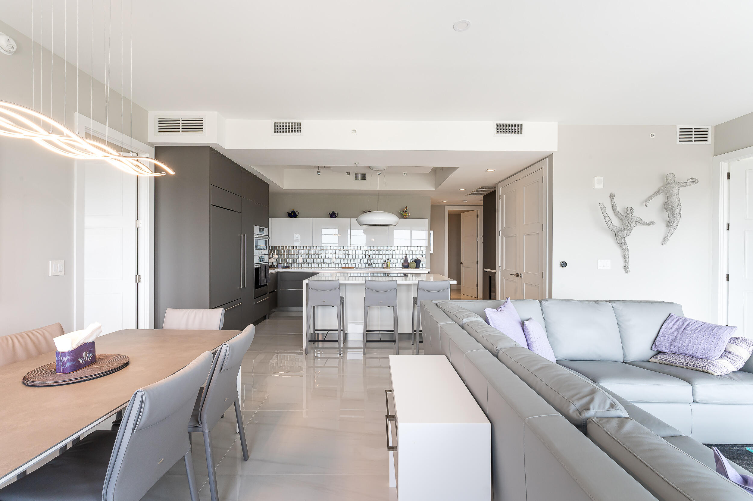 155 East Boca Raton Road, Unit 1107 Boca Raton, FL 33432 - Photo 8 of 53 a living room with stainless steel appliances kitchen island granite countertop furniture and a kitchen view