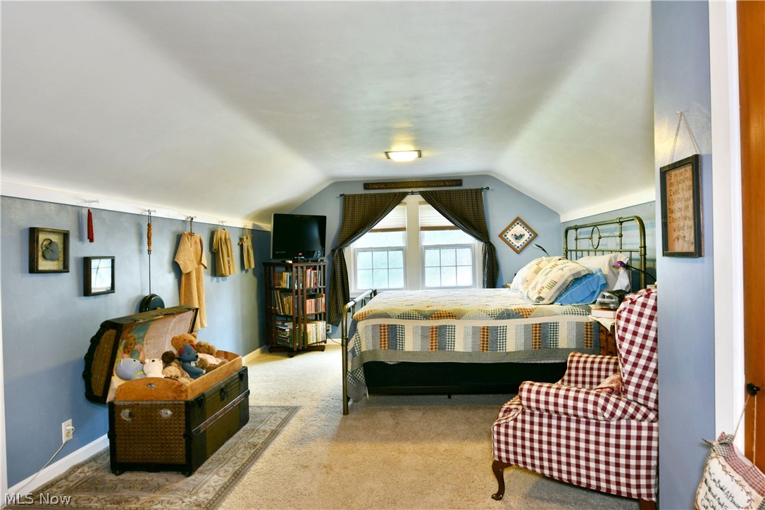 8683 King Graves Road Northeast Warren, OH 44484 - Photo 39 of 50 Carpeted room with sloped ceilings and light blue walls