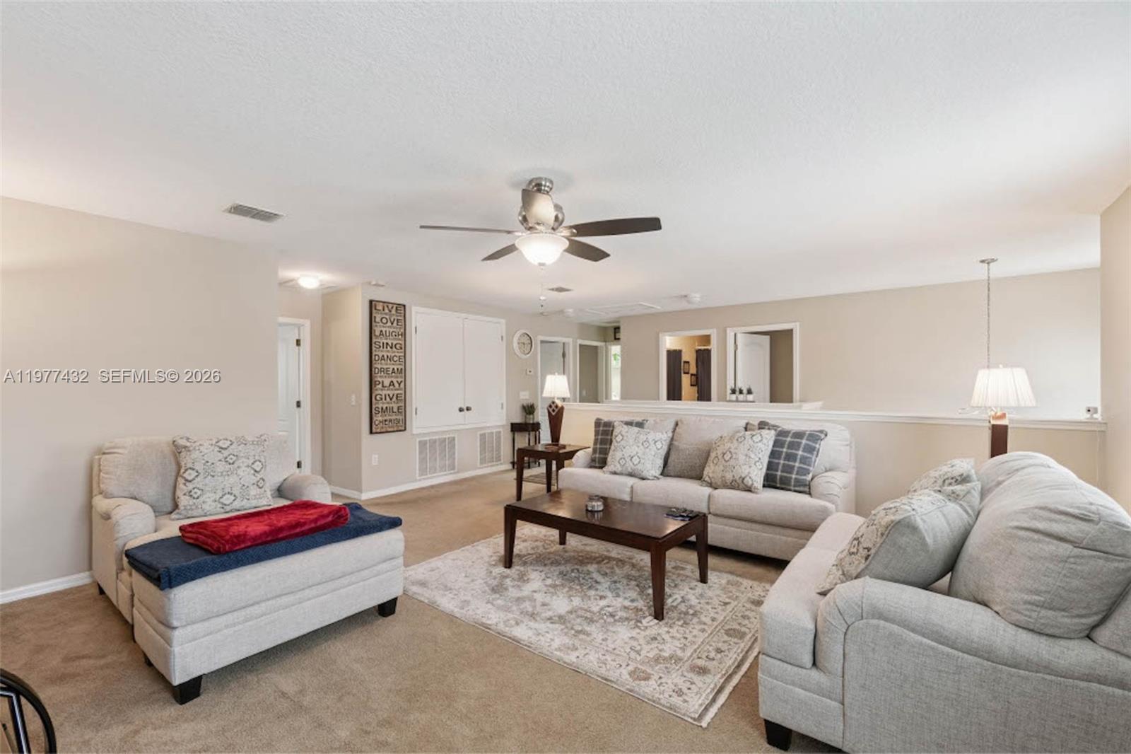 2502 Woodside Ridge Drive Apopka, FL 32712 - Photo 12 of 37 a living room with furniture and a ceiling fan
