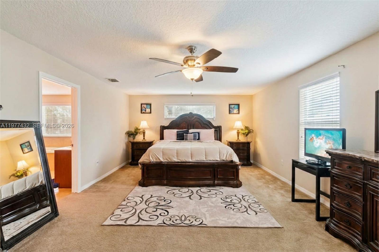 2502 Woodside Ridge Drive Apopka, FL 32712 - Photo 14 of 37 a living room with a couch and a chandelier