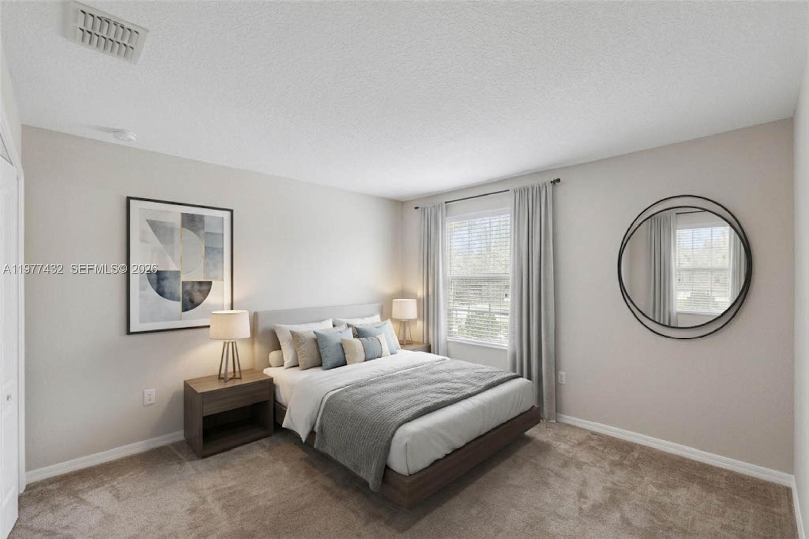 2502 Woodside Ridge Drive Apopka, FL 32712 - Photo 17 of 37 a bedroom with a bed and a window