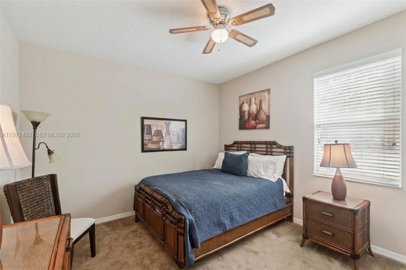 2502 Woodside Ridge Drive Apopka, FL 32712 - Photo 22 of 37 a bedroom with a bed and window