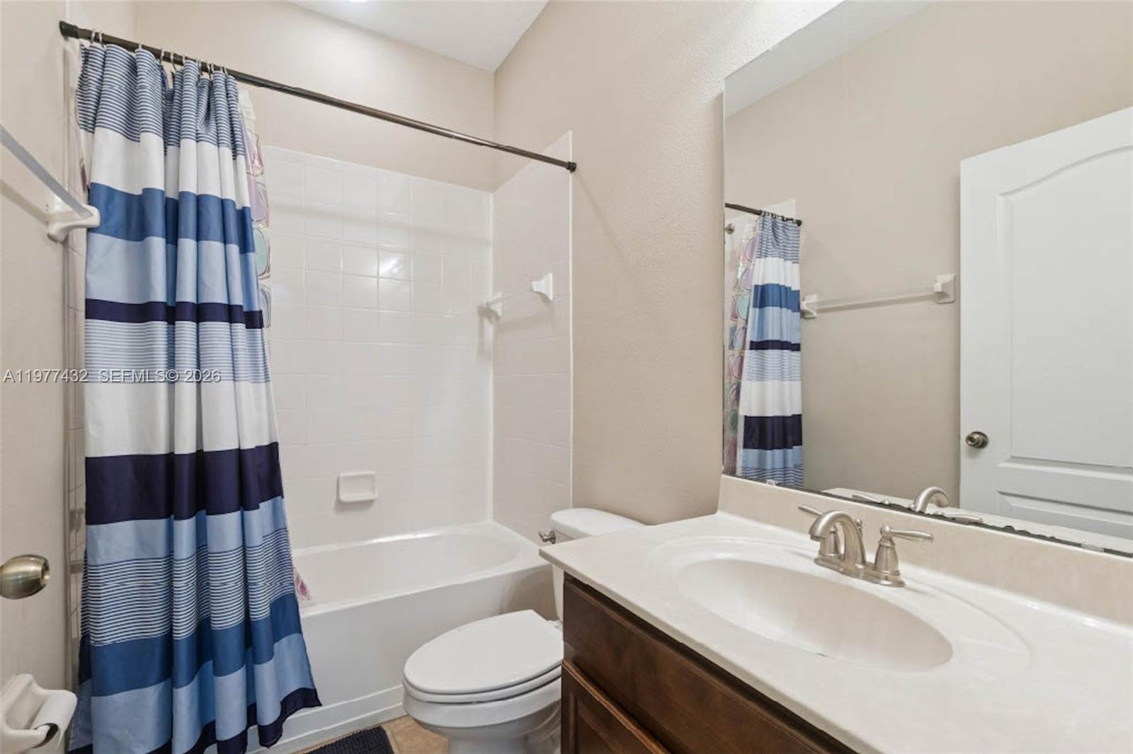 2502 Woodside Ridge Drive Apopka, FL 32712 - Photo 23 of 37 a bathroom with a sink toilet and shower