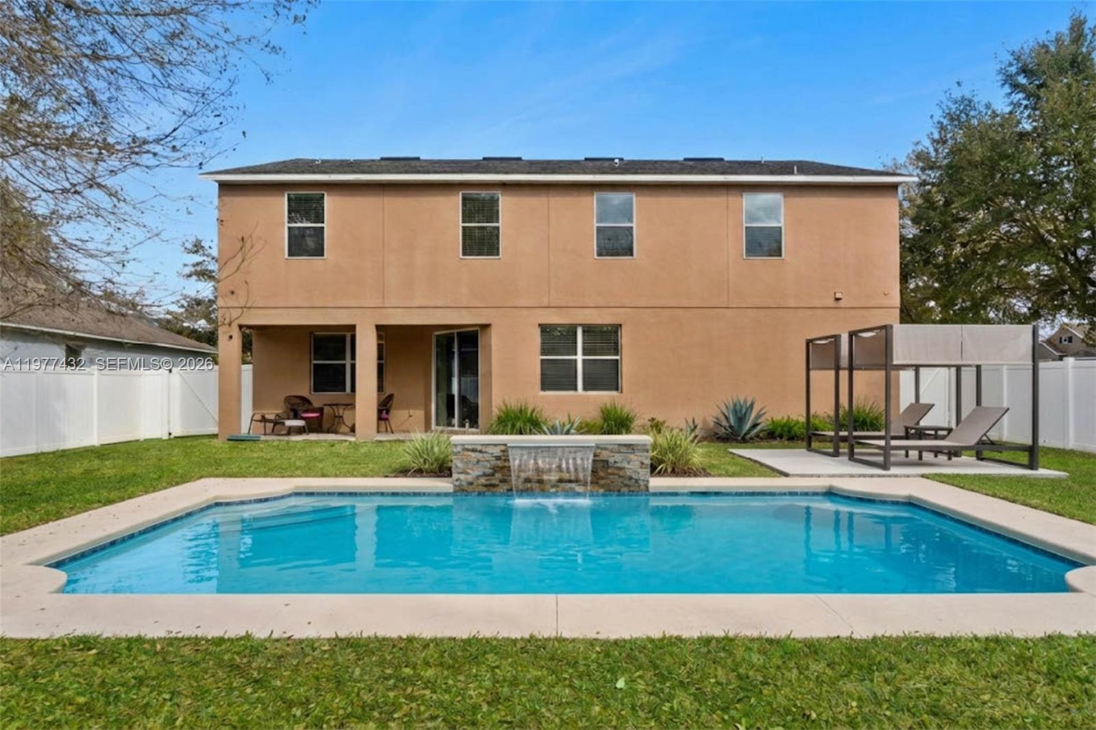 2502 Woodside Ridge Drive Apopka, FL 32712 - Photo 25 of 37 a view of a house with pool and a yard