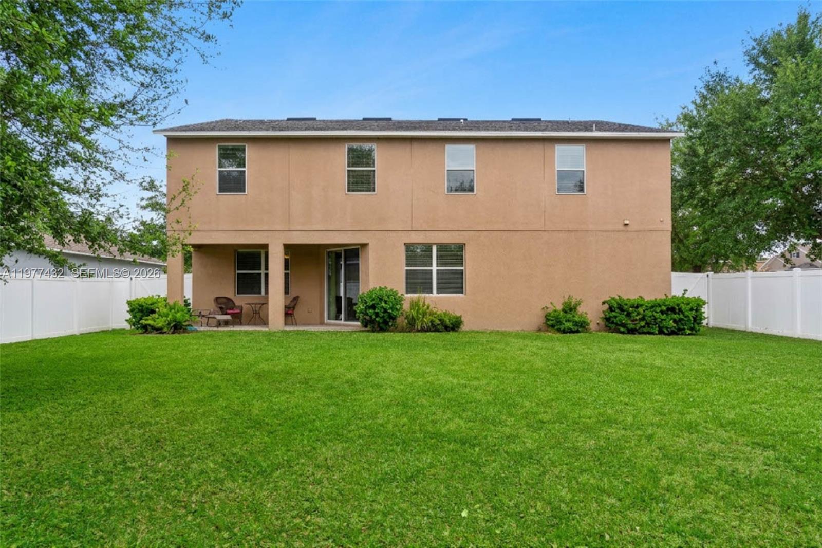 2502 Woodside Ridge Drive Apopka, FL 32712 - Photo 26 of 37 a front view of a house with a yard and garage