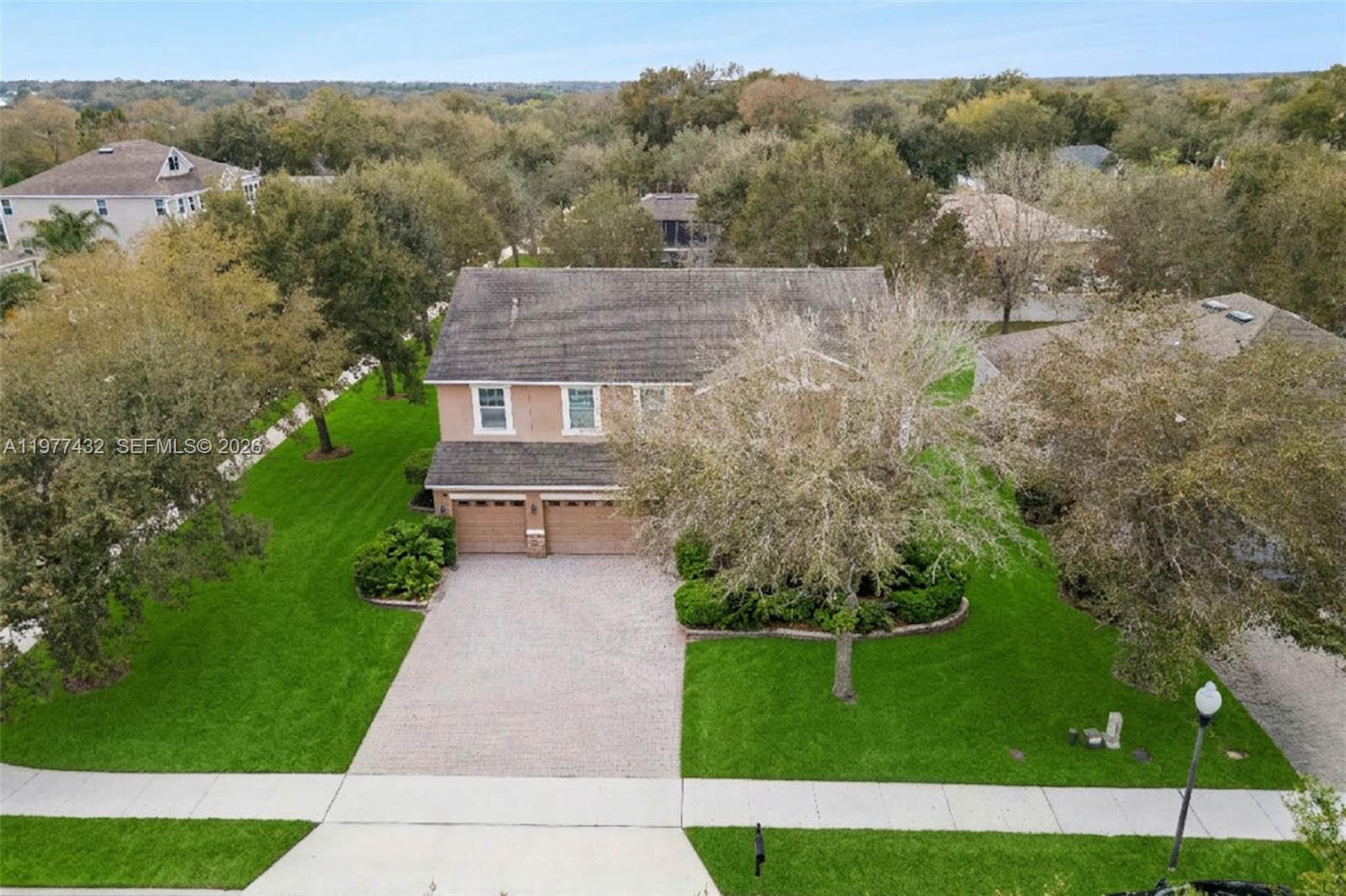2502 Woodside Ridge Drive Apopka, FL 32712 - Photo 27 of 37 a aerial view of a house with a yard