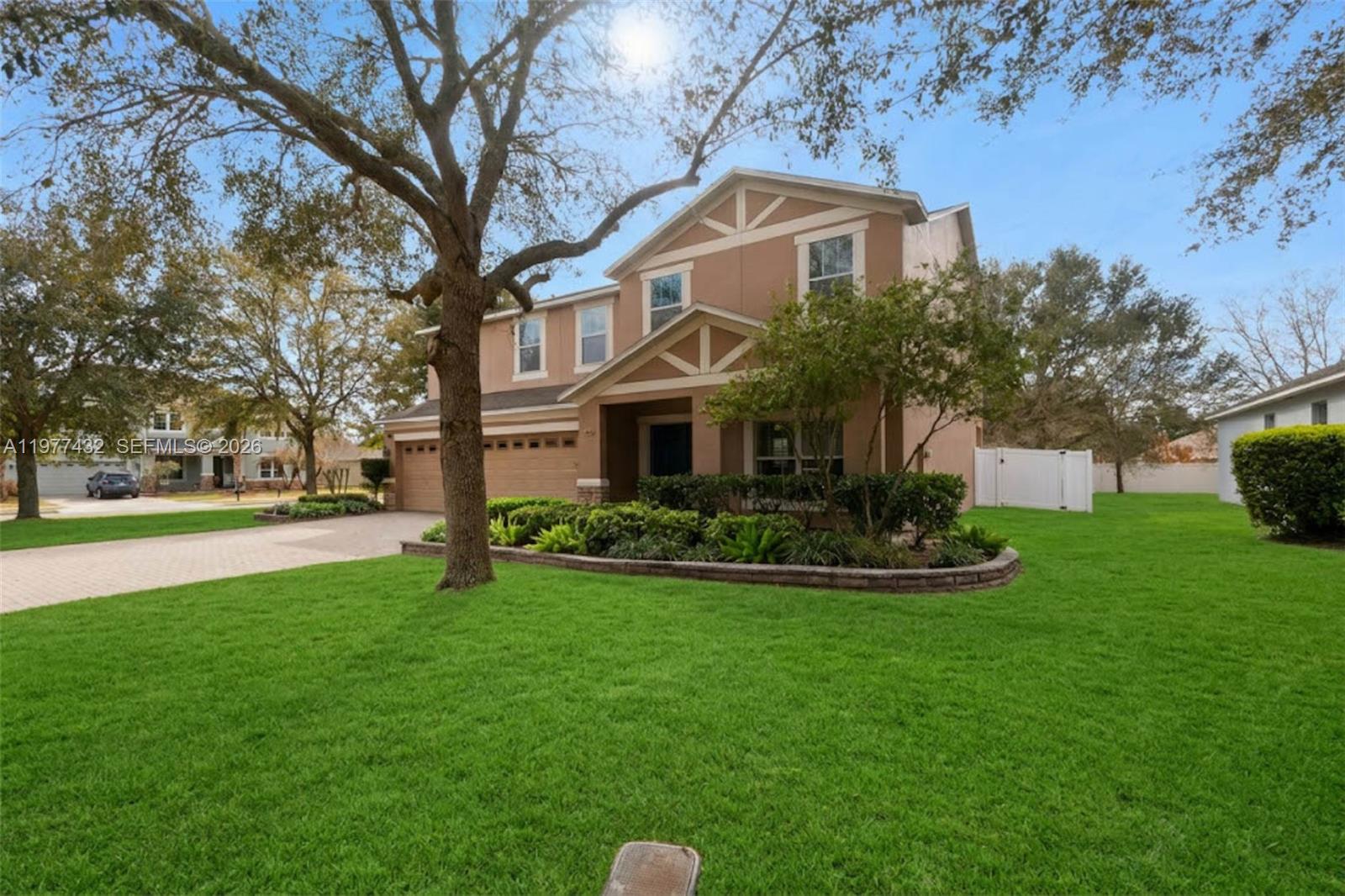 2502 Woodside Ridge Drive Apopka, FL 32712 - Photo 29 of 37 a front view of a house with a yard and trees