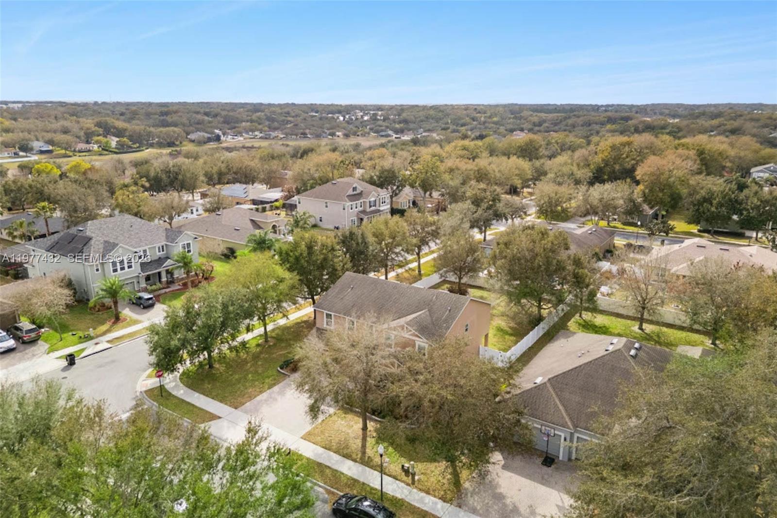 2502 Woodside Ridge Drive Apopka, FL 32712 - Photo 30 of 37 an aerial view of a house with a yard