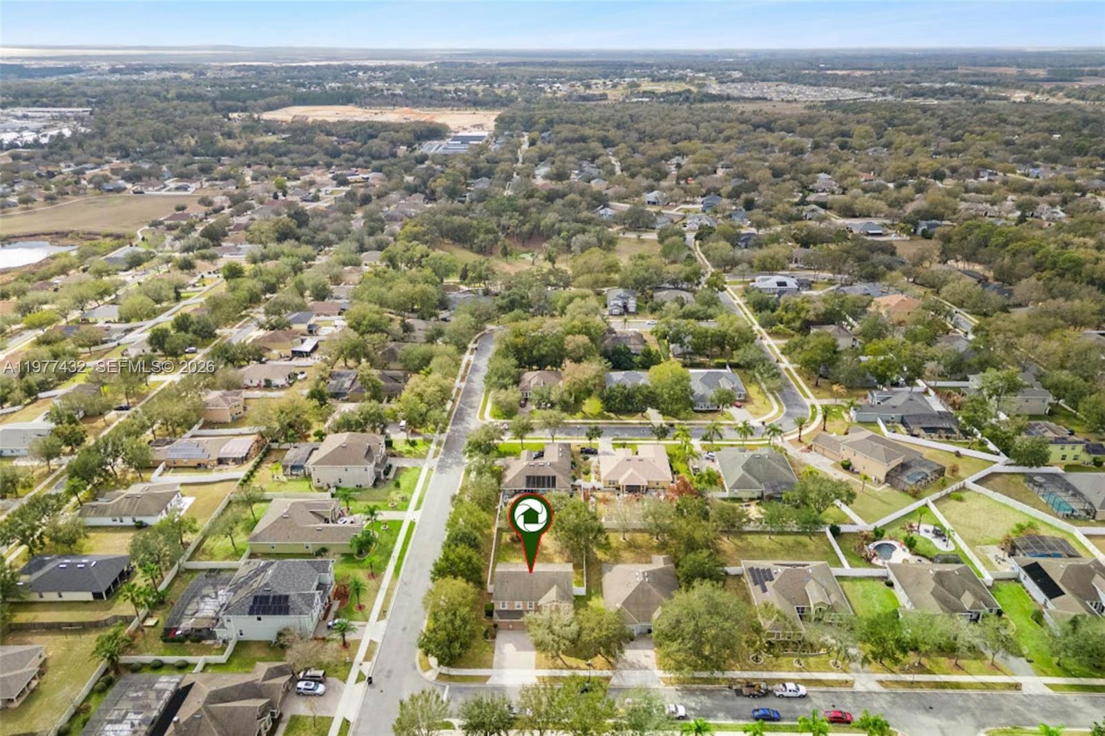 2502 Woodside Ridge Drive Apopka, FL 32712 - Photo 31 of 37 an aerial view of residential building and parking space