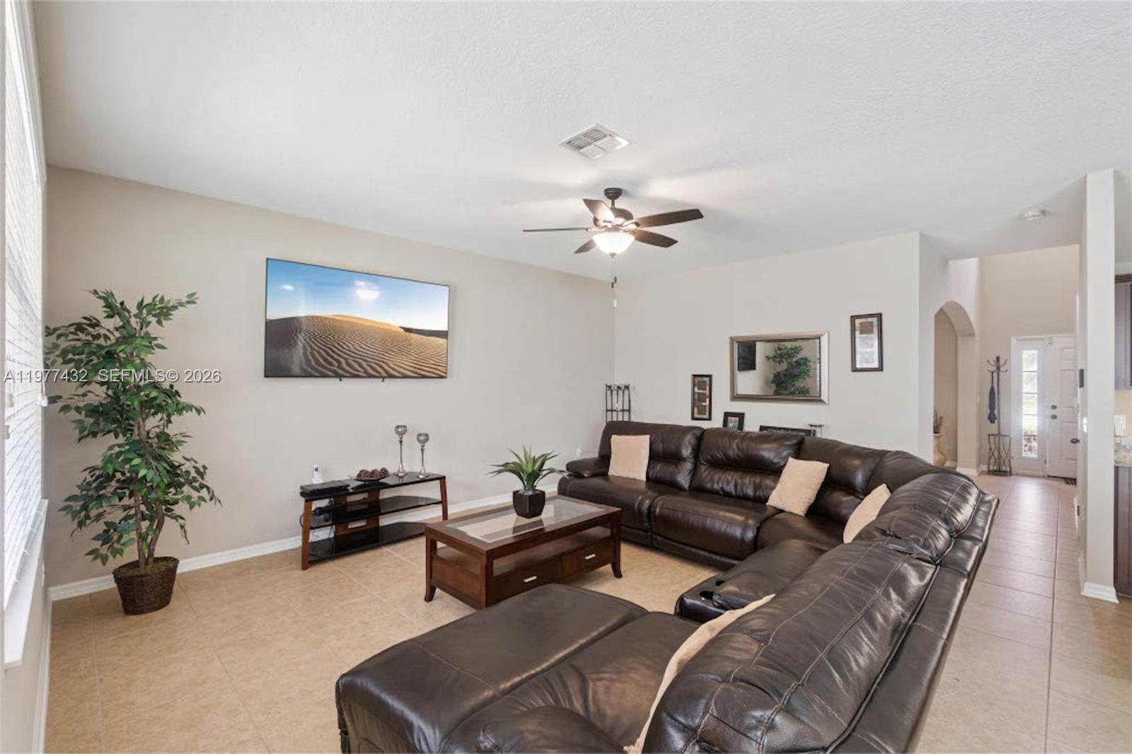 2502 Woodside Ridge Drive Apopka, FL 32712 - Photo 4 of 37 a living room with furniture and a potted plant