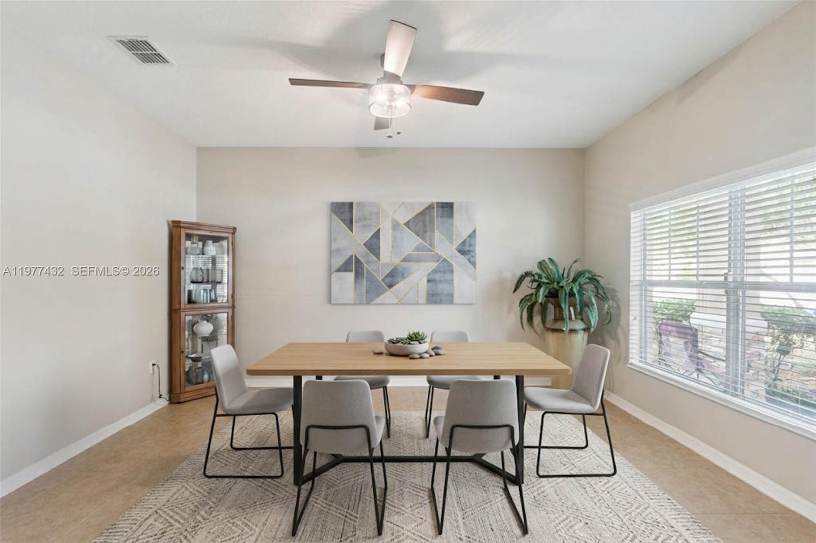 2502 Woodside Ridge Drive Apopka, FL 32712 - Photo 9 of 37 a dining room with furniture and window
