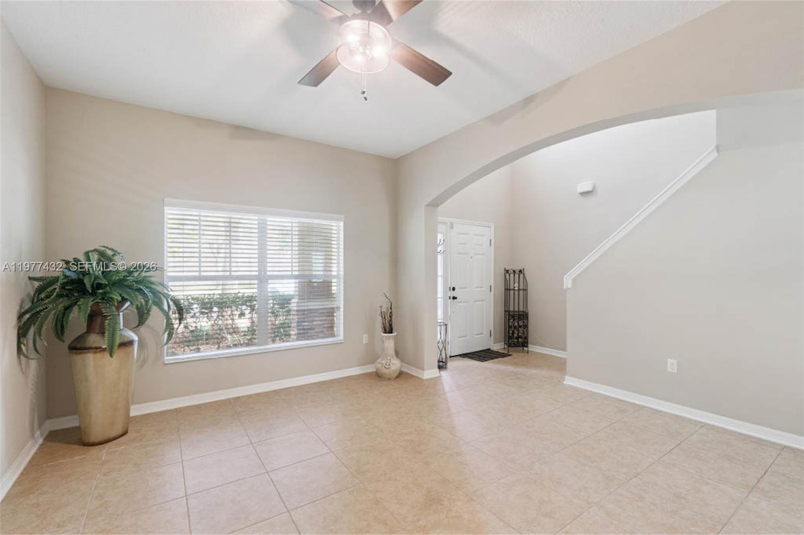 2502 Woodside Ridge Drive Apopka, FL 32712 - Photo 10 of 37 an empty room with window and glass door