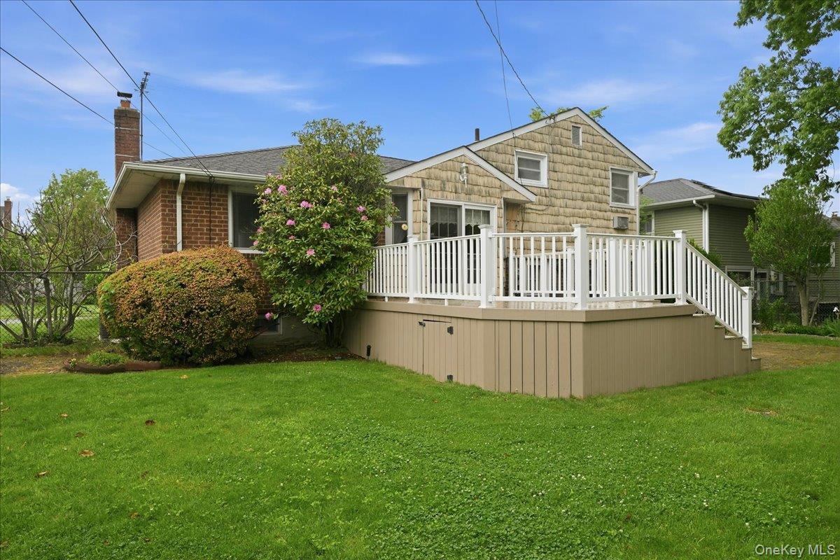 17 Avon Road Farmingdale, NY 11735 - Photo 39 of 46 a front view of a house with a garden