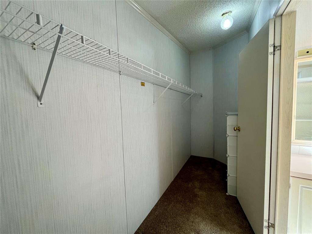 10614 Hayden Avenue New Port Richey, FL 34655 - Photo 13 of 23 a view of a room with wooden walls