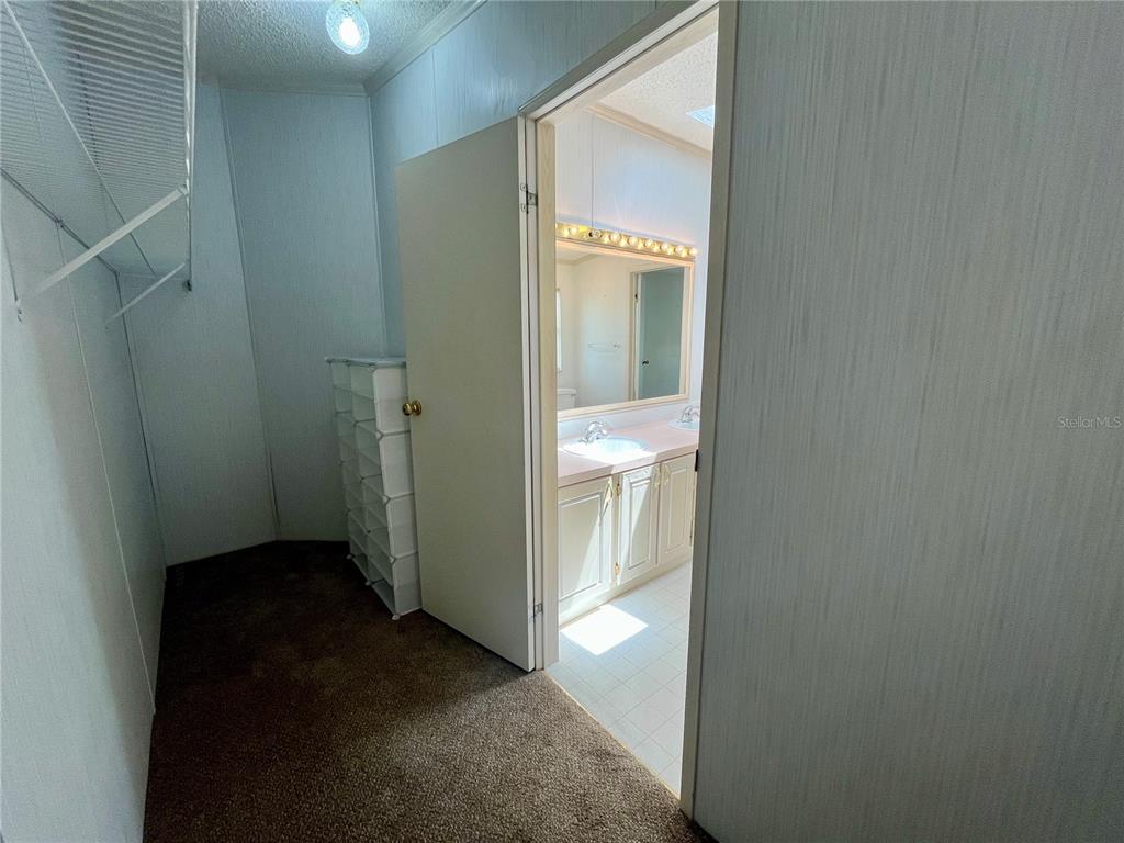 10614 Hayden Avenue New Port Richey, FL 34655 - Photo 14 of 23 a view of a bathroom from a hallway