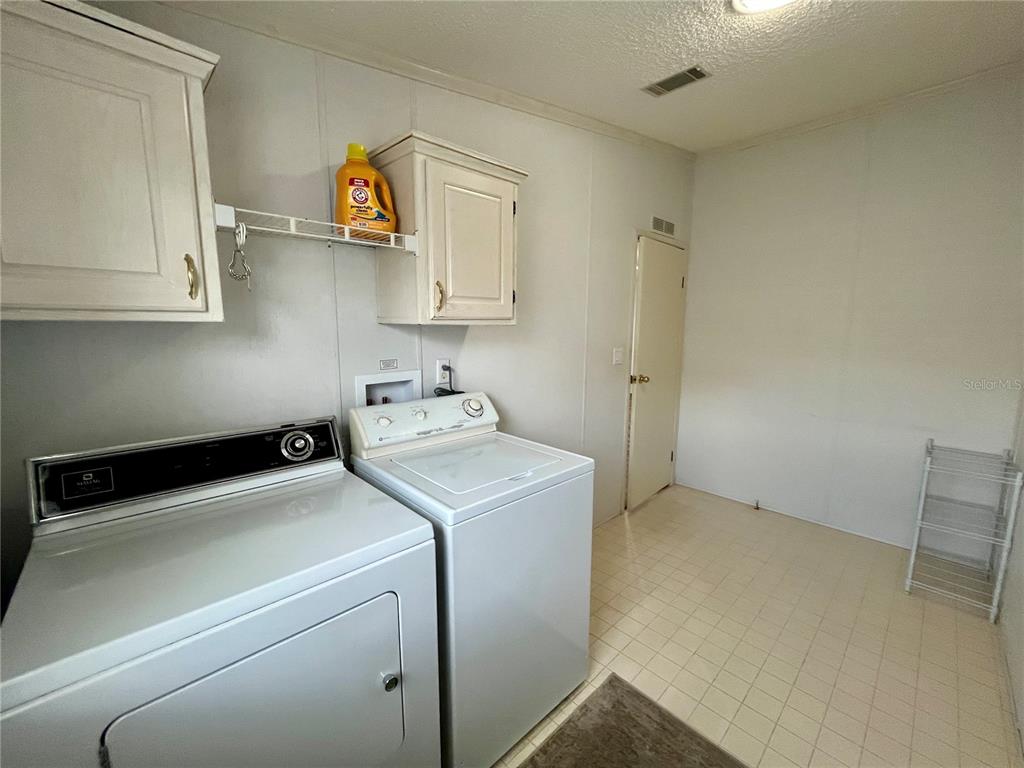 10614 Hayden Avenue New Port Richey, FL 34655 - Photo 16 of 23 a utility room with dryer and washer