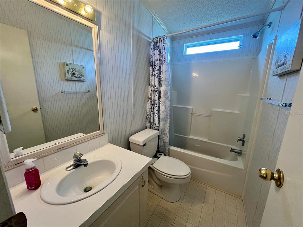 10614 Hayden Avenue New Port Richey, FL 34655 - Photo 19 of 23 a bathroom with a sink toilet and shower