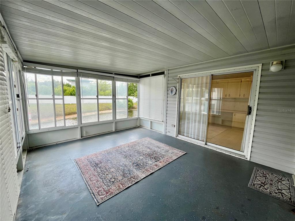 10614 Hayden Avenue New Port Richey, FL 34655 - Photo 8 of 23 a view of an empty room with a balcony