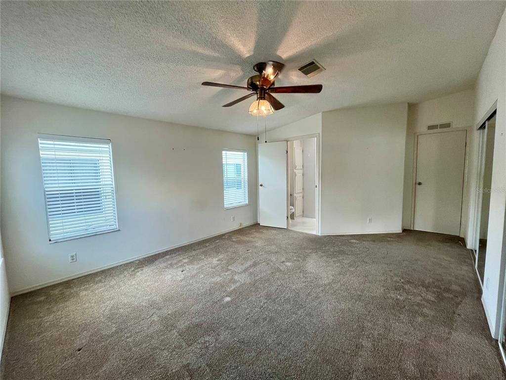 10614 Hayden Avenue New Port Richey, FL 34655 - Photo 10 of 23 a view of a livingroom with a ceiling fan and window