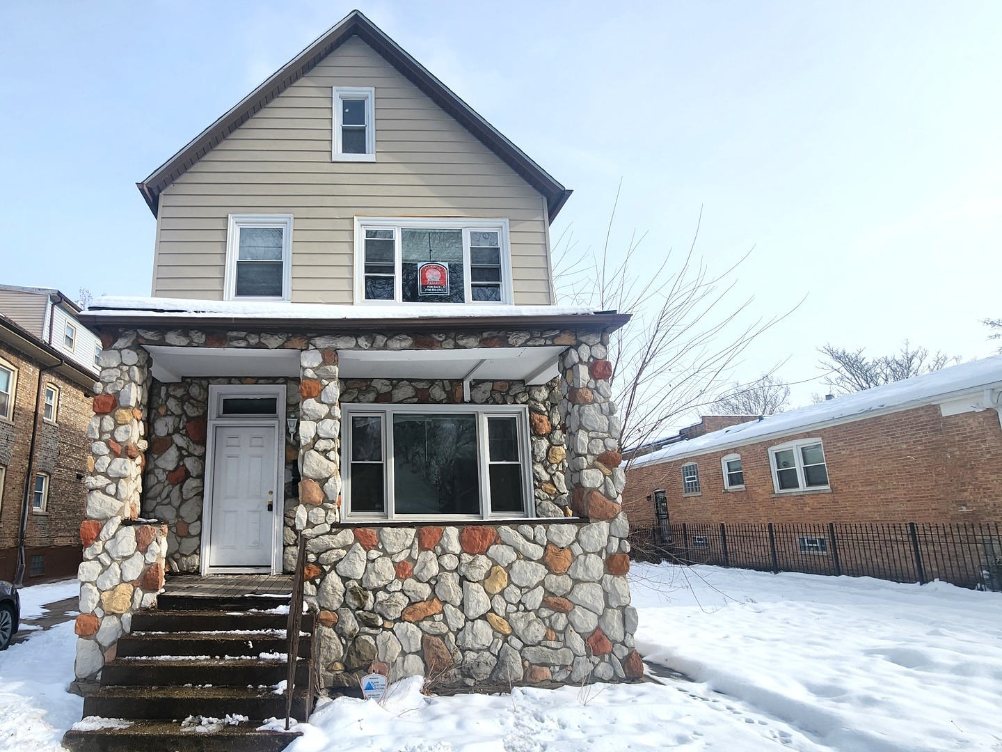 a front view of house with stairs