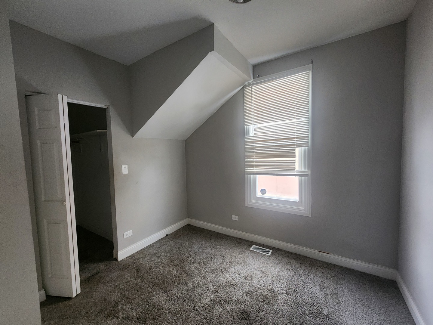 12211 South Wallace Street Chicago, IL 60628 - Photo 7 of 17 an empty room with windows