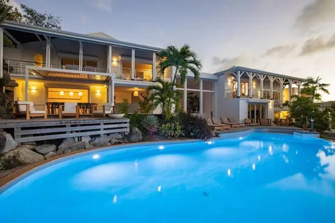 a view of swimming pool with seating area