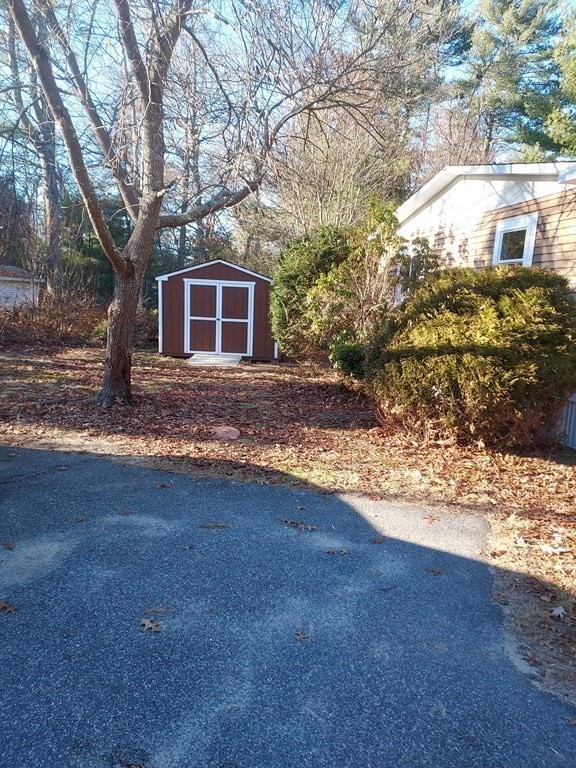 61 Longboat Road West Wareham, MA 02576 - Photo 4 of 15 a view of a house with a yard