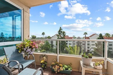 a view of a chairs and table in patio with a barbeque grill