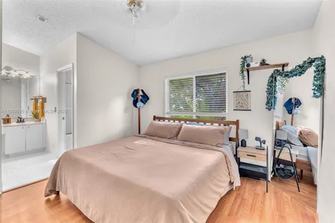 a bedroom with a bed and a table