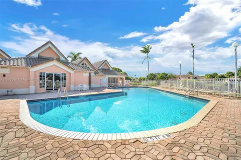 a view of swimming pool from a balcony
