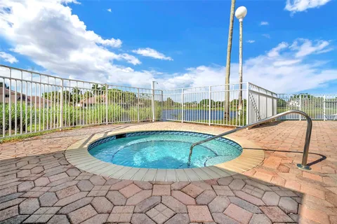 a view of a swimming pool with a lounge chair