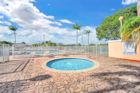 front view of a house with a garden