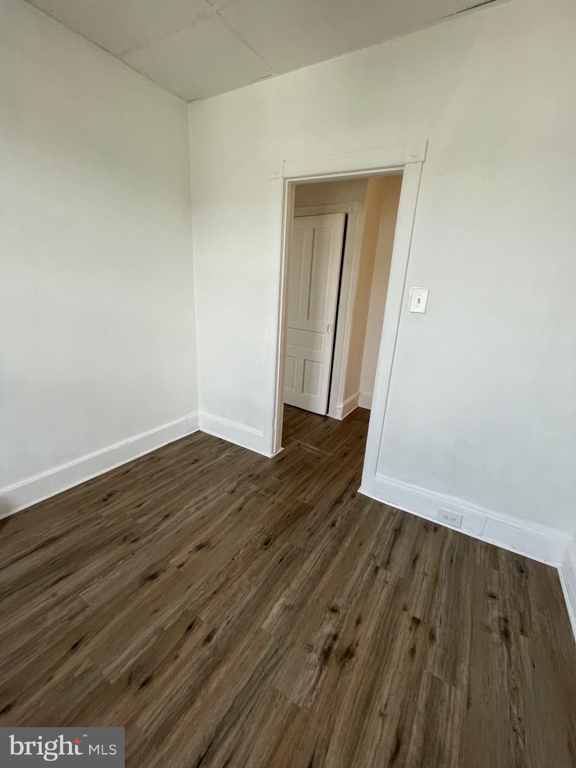 1426 Snyder Avenue Philadelphia, PA 19145 - Photo 12 of 16 an empty room with wooden floor and closet