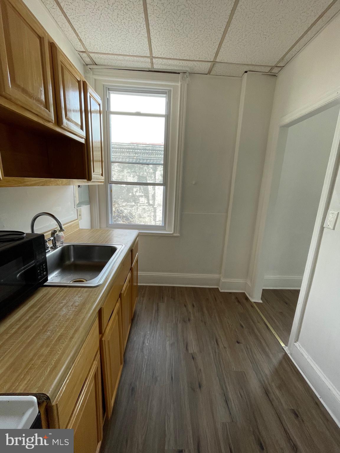 1426 Snyder Avenue Philadelphia, PA 19145 - Photo 13 of 16 a kitchen that has a sink and a stove in it