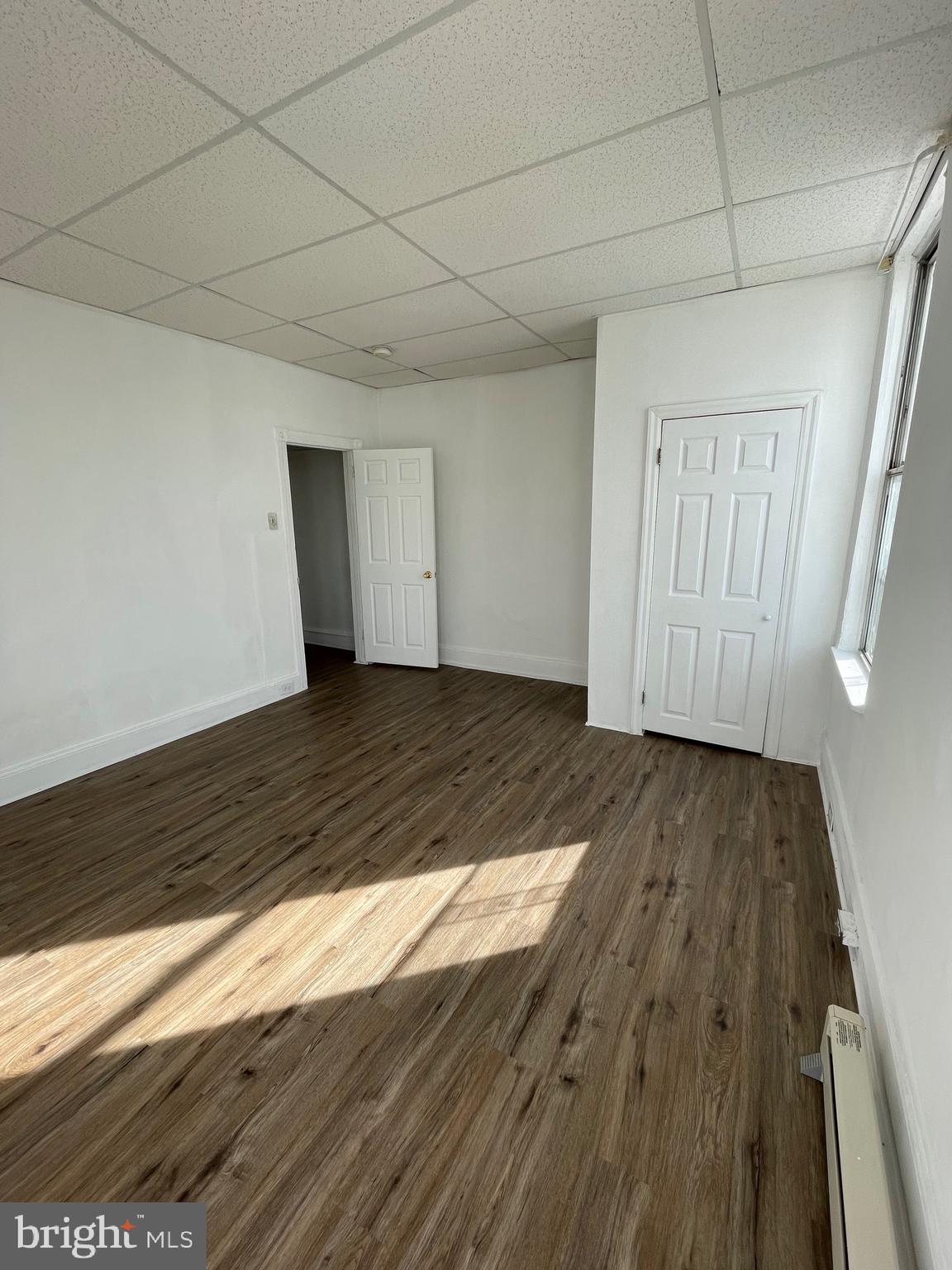 1426 Snyder Avenue Philadelphia, PA 19145 - Photo 4 of 16 a view of an empty room and wooden floor