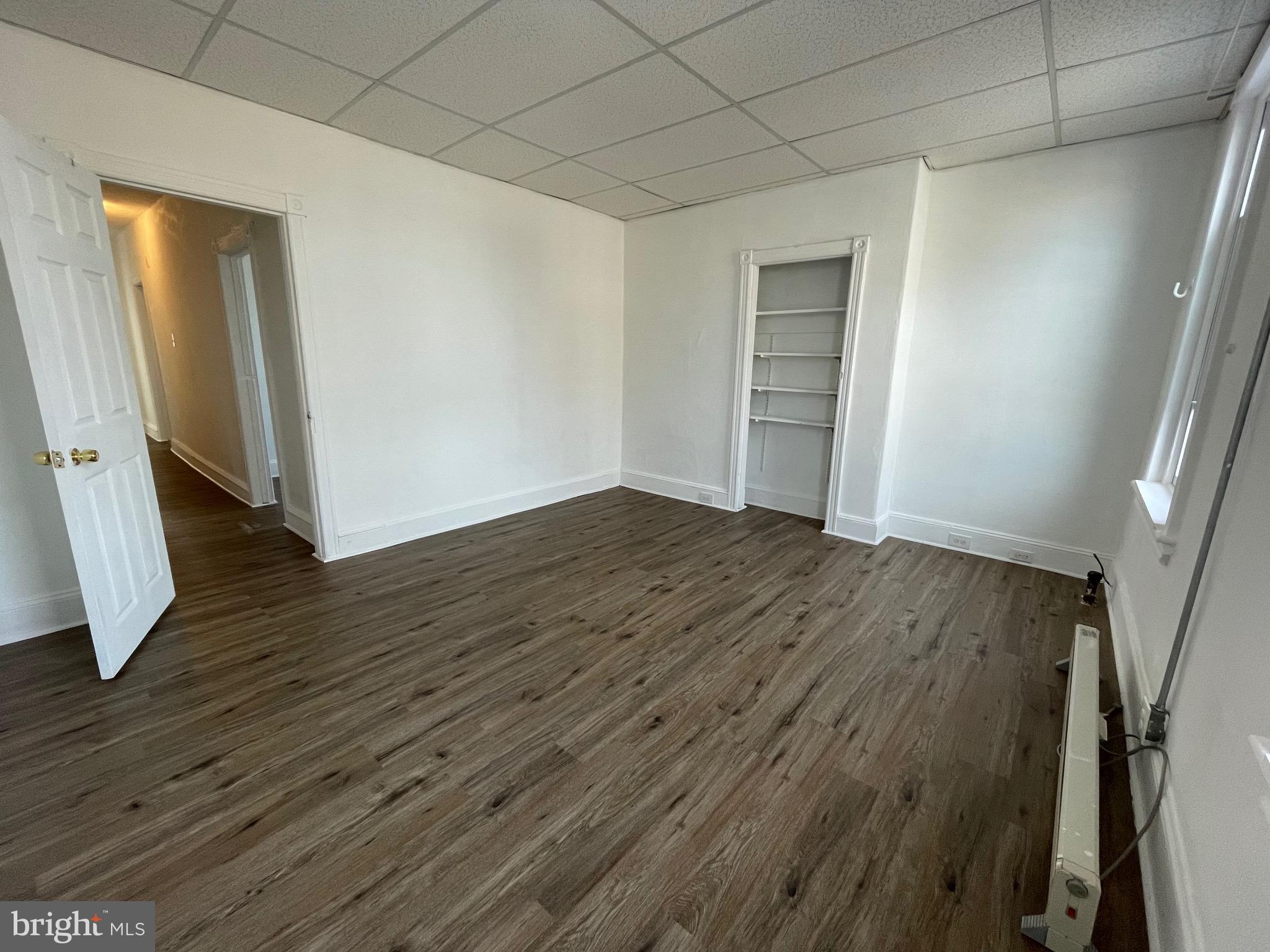 1426 Snyder Avenue Philadelphia, PA 19145 - Photo 7 of 16 an empty room with wooden floor and closet