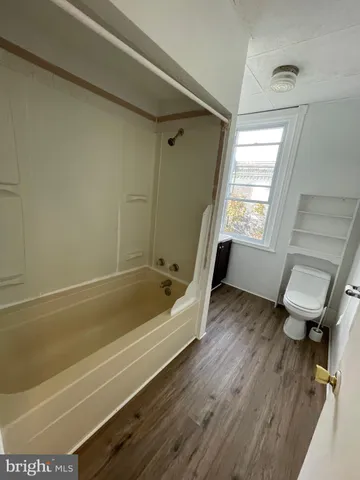a bathroom with a sink a toilet and a bathtub
