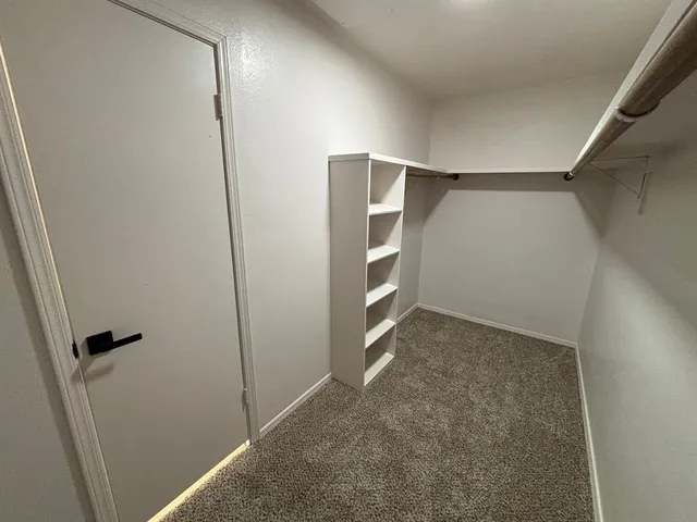 a view of livingroom with hardwood floor and a ceiling fan