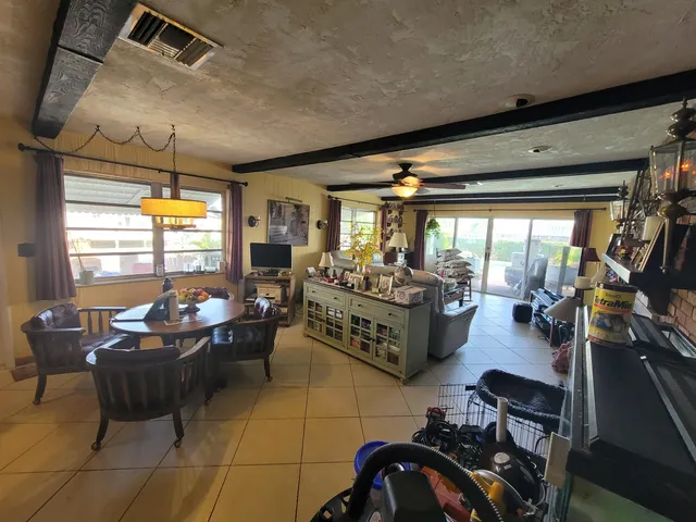 a room with gym equipment and large window