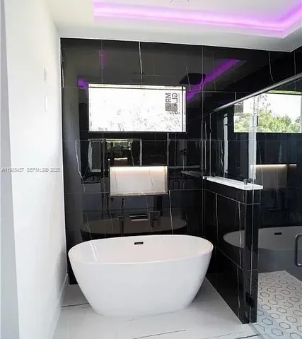 a bathroom with a bathtub and a sink